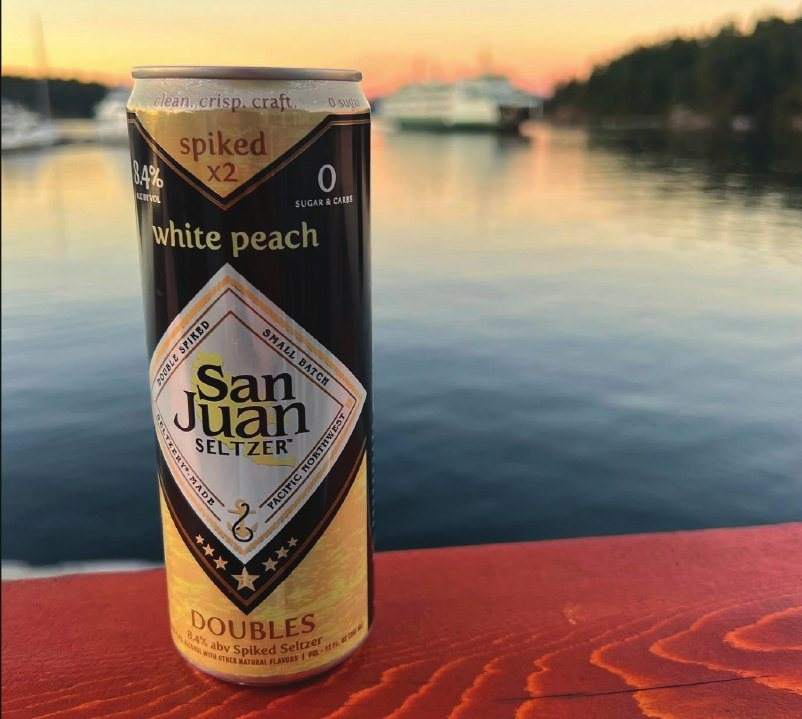 White Peach can at sunset on the water