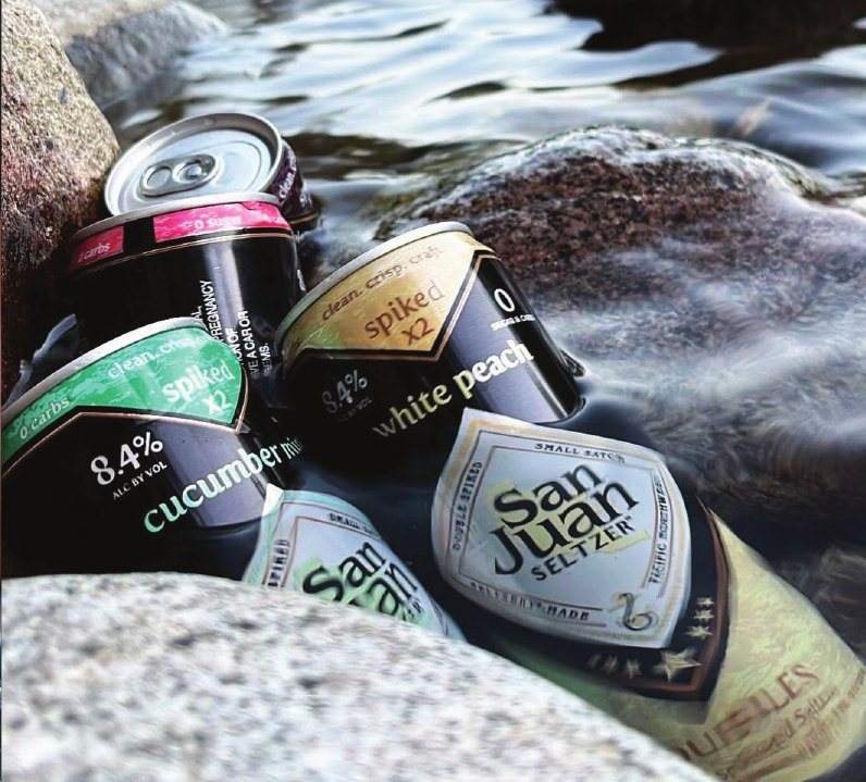 Doubles cans on river rocks