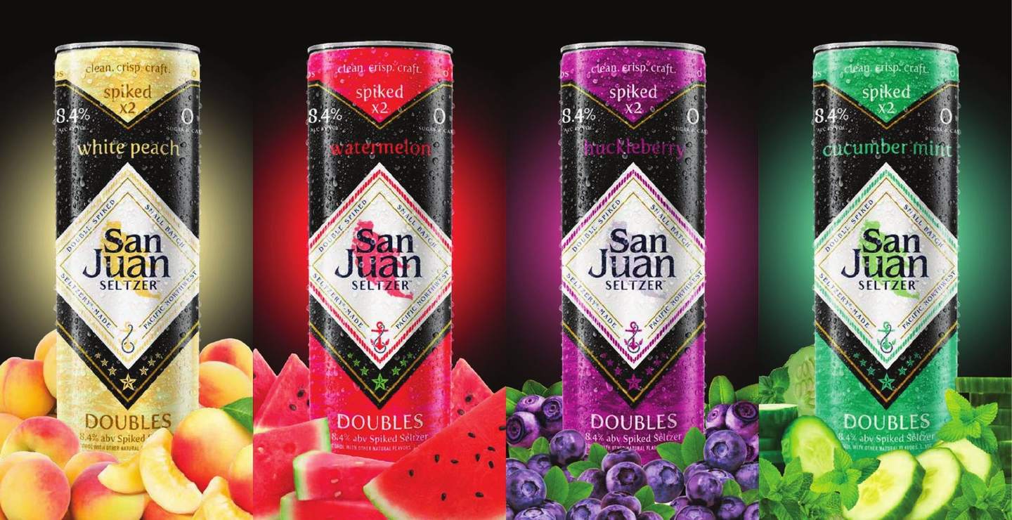 Four Doubles cans, White Peach, Watermelon, Huckleberry and Cucumber Mint, with their fruit